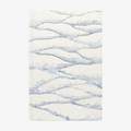 Softcover notebook with wavy blue pattern on a white background