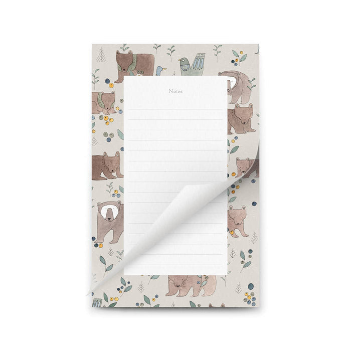 Notepad with bear illustrations on a white background