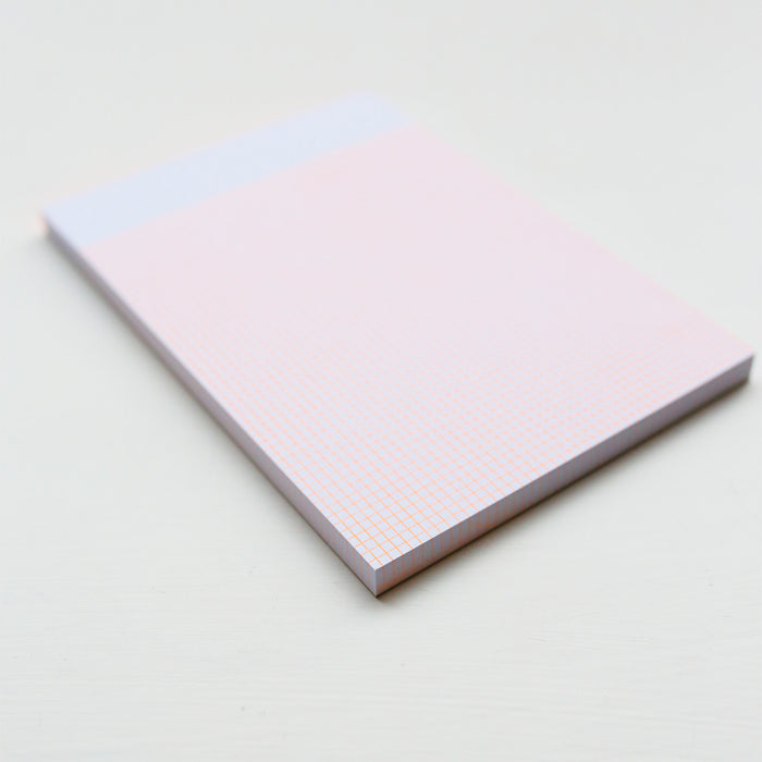 Notebook with a grid on a light background