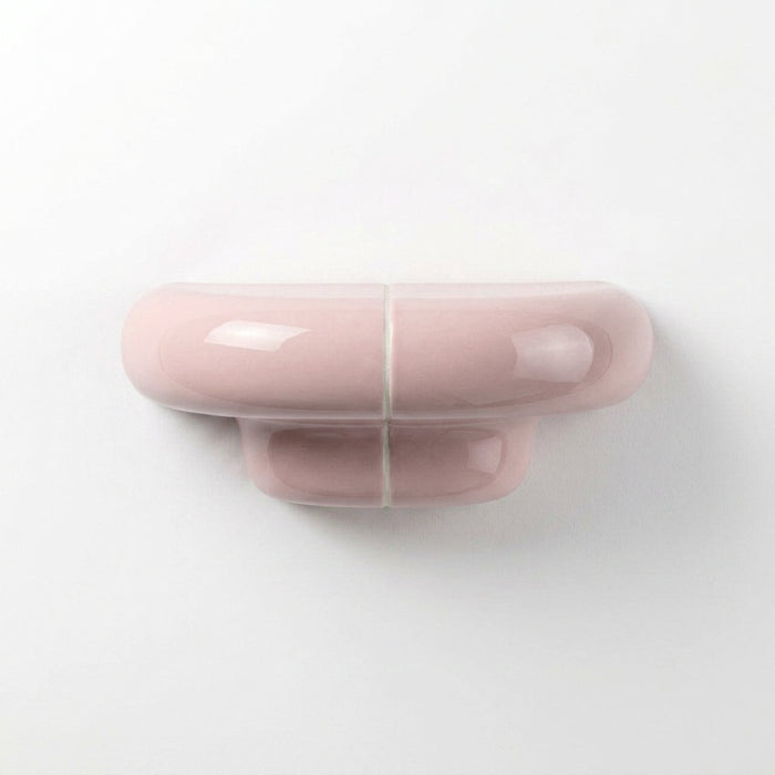Orbi XS designer floating shelf in glossy Blush Pink, compact handcrafted shelf for contemporary interiors.