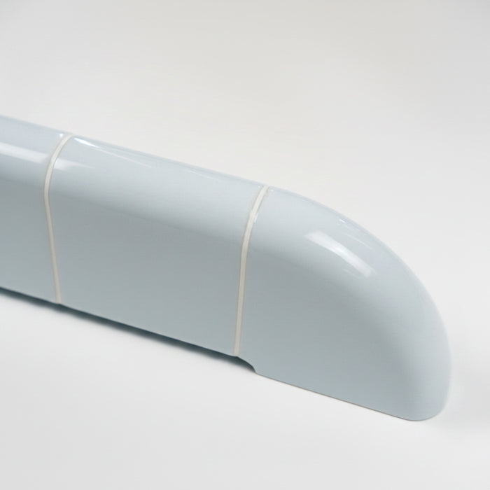 Close-up of the Orbi shelf in glossy Ice Blue, highlighting its rounded ceramic-inspired surface.