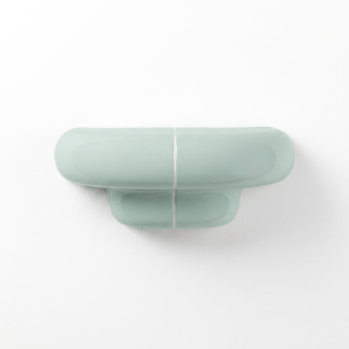 Orbi XS floating wall shelf in glossy Pastel Mint, modern handcrafted shelf for contemporary interiors.