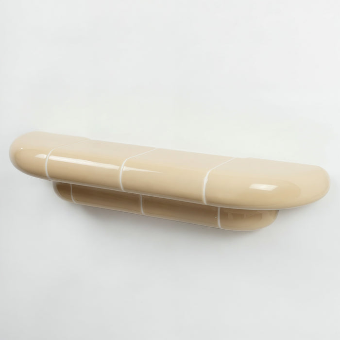 Orbi designer floating shelf in glossy Soft Butter finish, handcrafted in Spain.
