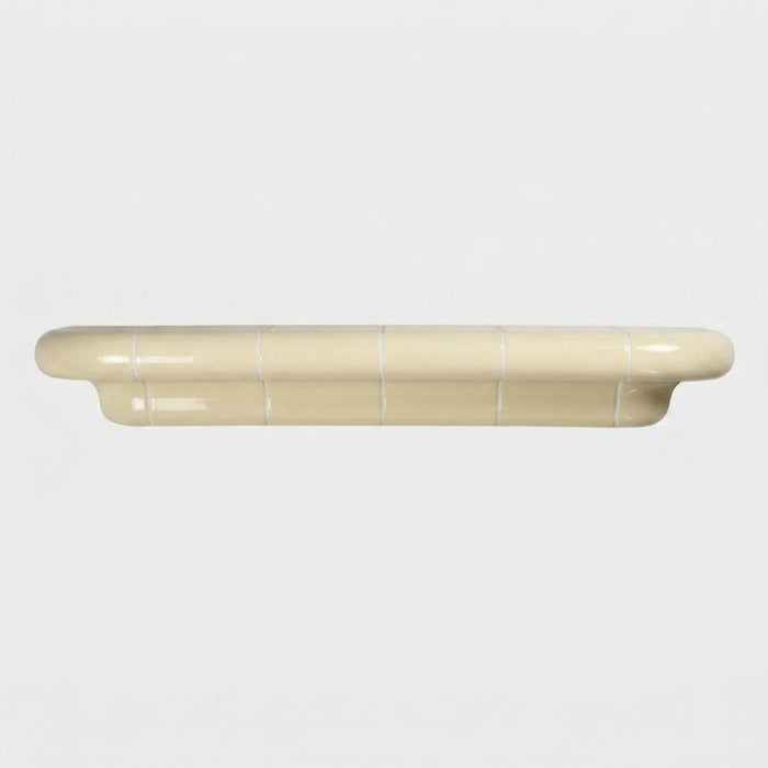 Orbi XL floating shelf in glossy Soft Butter, statement wall shelf for modern interiors.