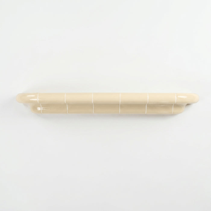 Orbi XXL extra-long floating shelf in glossy Soft Butter, handcrafted modular wall shelf.