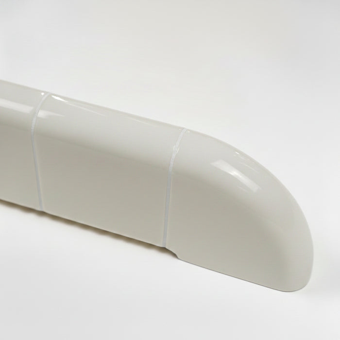 Close-up of the Orbi wall shelf showing the glossy Off-White finish and rounded ceramic-inspired details.
