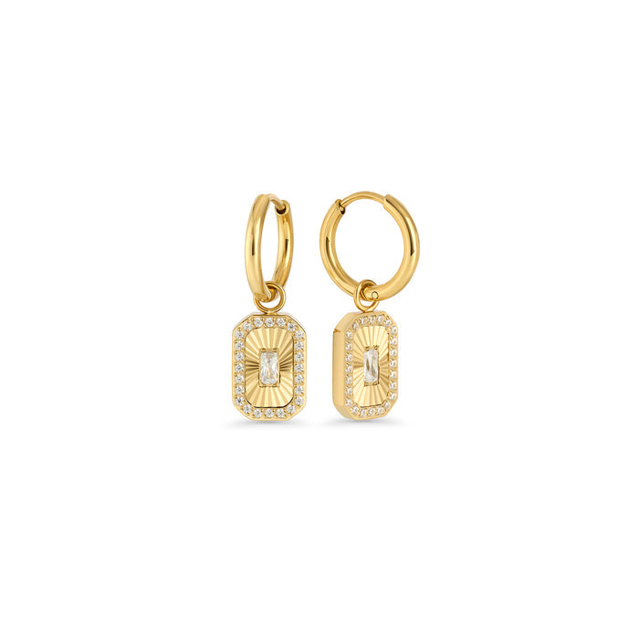 Gold hoop earrings with a rectangular octagonal pendant featuring a fluted sunburst center and baguette cubic zirconia on a white background. Nickel-free and waterproof jewelry by Mia Bijoux Canada.

Boucles d'oreilles anneaux dorées avec pendentif rectangulaire octogonal à motif rayonnant strié et zircon taille baguette sur fond blanc. Bijoux sans nickel et résistants à l'eau par Mia Bijoux Canada.