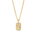 A gold chain necklace with a rectangular octagonal pendant featuring a fluted sunburst center, a baguette-cut clear stone and a pavé stone halo. Waterproof, stainless steel and allergy free. By MIAJWL.

Collier à chaîne dorée avec pendentif rectangulaire octogonal à motif rayonnant strié, serti d'une pierre transparente taille baguette et d'un halo de pierres pavées. Résistant à l'eau, en acier inoxydable et hypoallergénique. Par MIAJWL.
