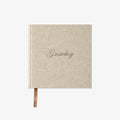 Beige guestbook with 'Gæstebog' text on a white background
