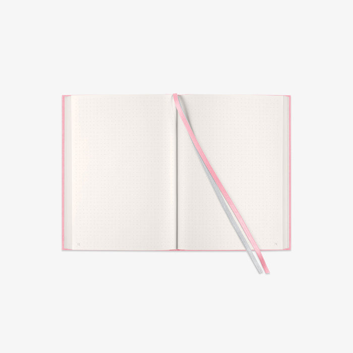 Open notebook with a pink and grey ribbon