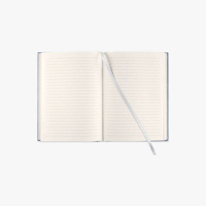 Open notebook with lined pages on a white background