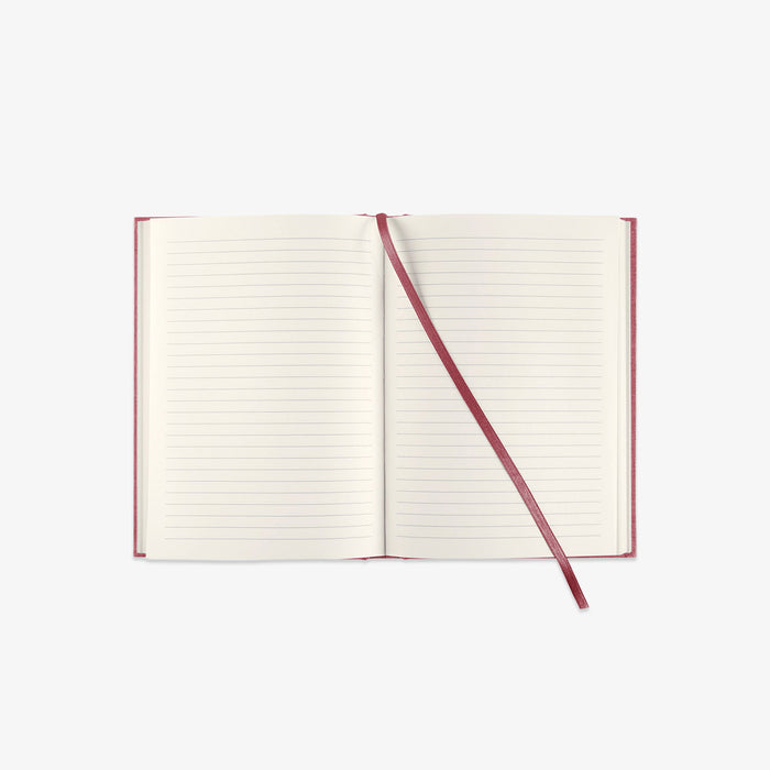 Linned hardcover notebook in red with lined pages