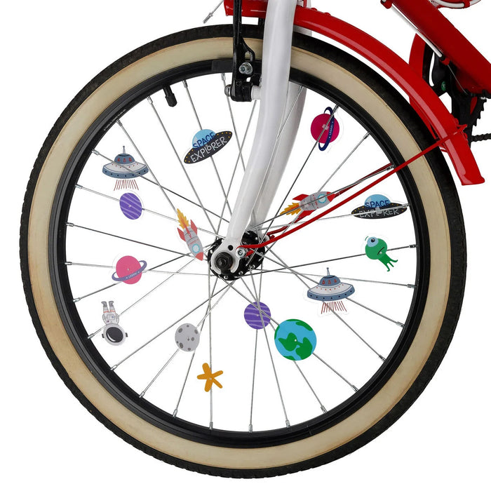 Bicycle wheel with colorful space-themed decals on a white background