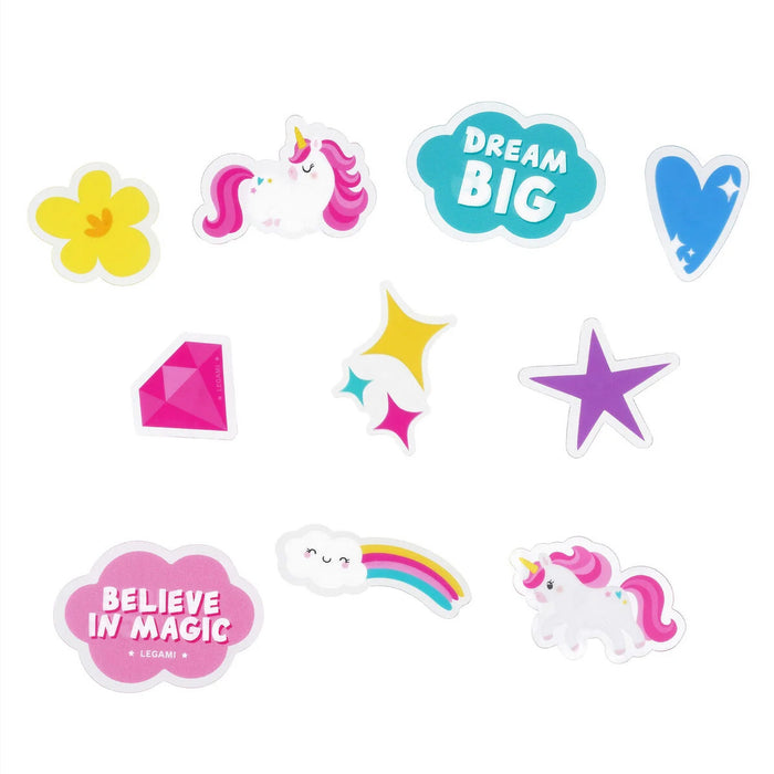 Set of colorful bike decorations with unicorns, flowers, stars, and motivational phrases on a white background.