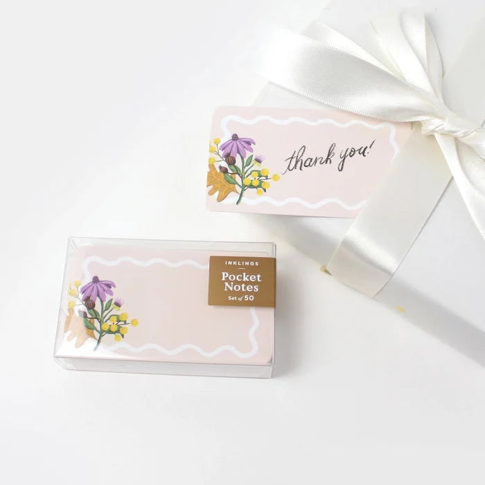 Box of pocket notes with floral design and 'thank you' text on a white background