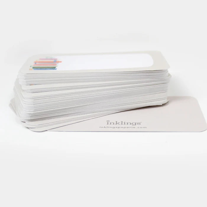 Stack of white cards with a book stack illustration and 'inklings' branding on a white background