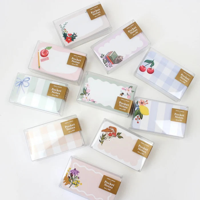 Collection of small pocket card sets with various designs on a white background