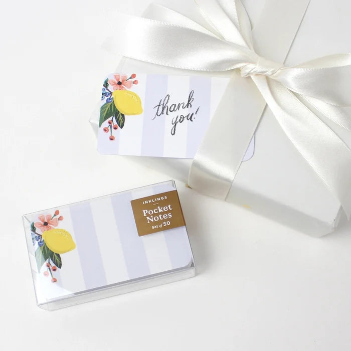 Packaged pocket notes with 'thank you' card and lemon design on a white background