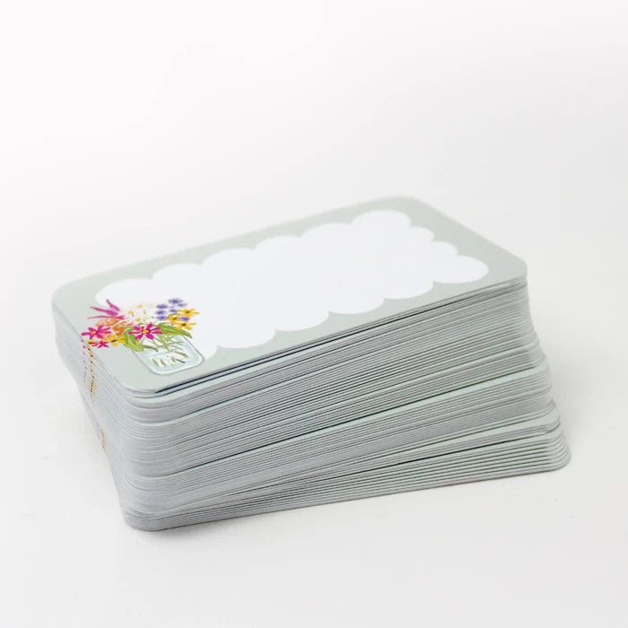 Stack of pocket cards with a floral design on a white background