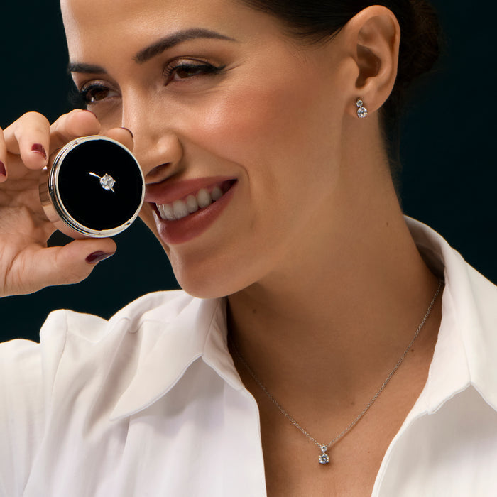 Cubic zirconia solitaire jewelry set with stainless steel pendant necklace, stud earrings and matching ring, timeless minimalist design with brilliant diamond-like stone.