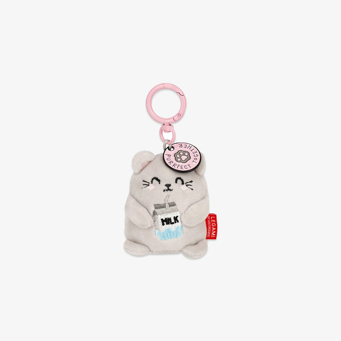 Plush keychain shaped like a cat holding a milk bottle on a white background