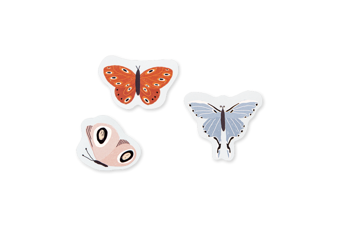 Three butterfly-shaped stickers on a white background