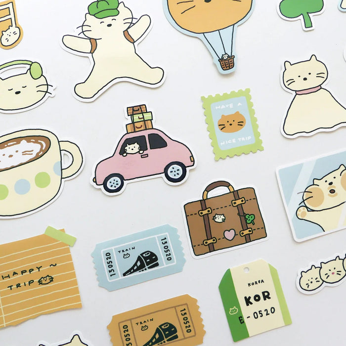 Collection of cute travel-themed stickers with cats and travel items on a white background
