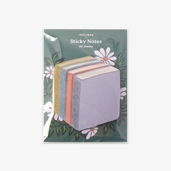 Pack of book stack-shaped sticky notes with floral design on a green background