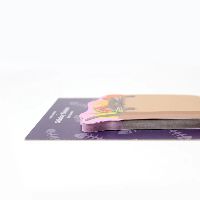 Stack of colorful grocery-kitten-shaped sticky notes on a white background