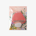 Sticky notes with mushroom design on a pink background