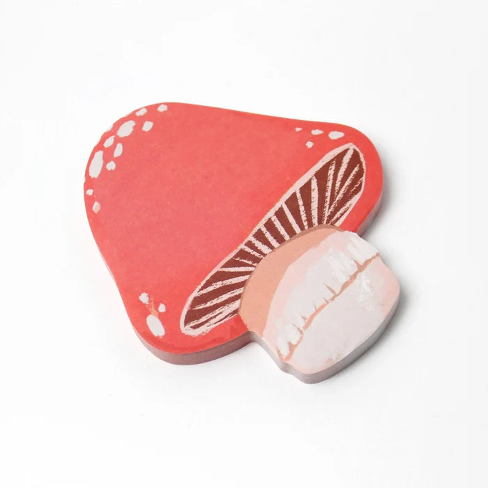Mushroom-shaped sticky note on a white background