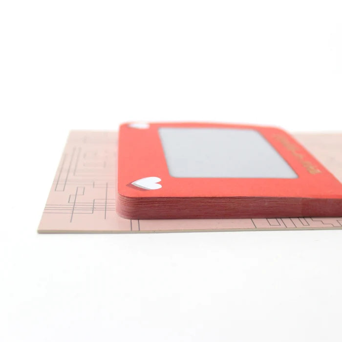 Stack of rsticky notes with a white heart design on a white background