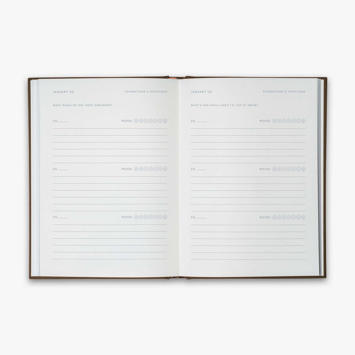 Open book from our Three Year Journal with the daily prompts on a white background