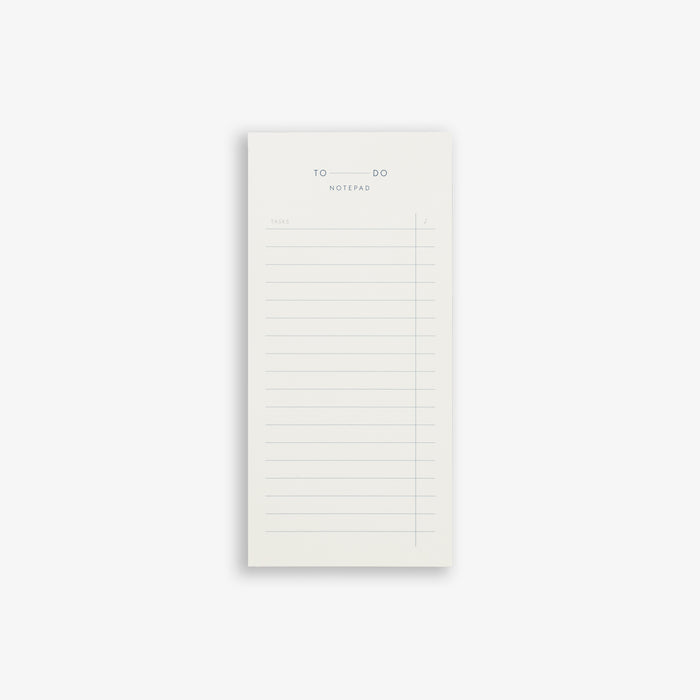 A white tear-off notepad with 'TO DO' text on the cover, designed for task planning and note-taking.