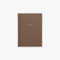 Brown guided journal with 'TRE ÅR' text embossed on the cover on a white background