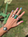 Turq X Ring (shown on middle finger)