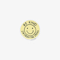 Round yellow sticker with smiley face and text 'Be kind, I'm from the 1900s' on a white background
