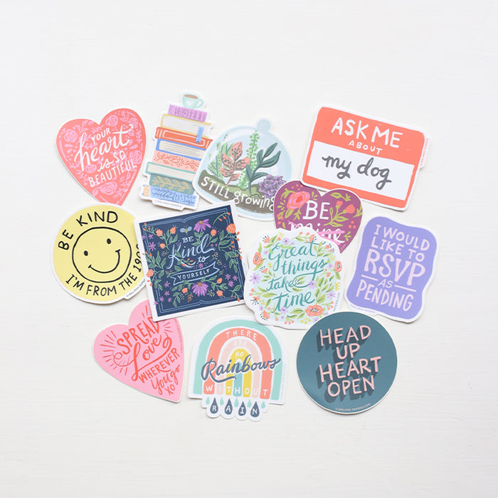 Collection of colorful stickers with various designs and messages on a white background