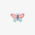 Colorful butterfly-shaped vinyl sticker with 'spread your wings' text on a white background