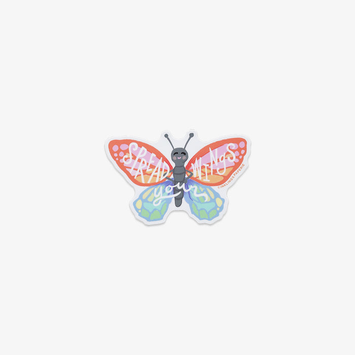 Colorful butterfly-shaped vinyl sticker with 'spread your wings' text on a white background