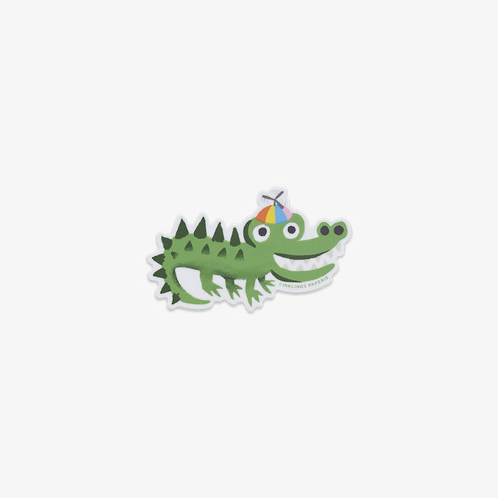 Cartoon lizard vinyl sticker with colorful hair on a white background