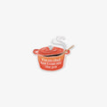 Vinyl sticker of a decorative pot with a spoon and the text ' I'm no chef but I can stir the pot' on a white background