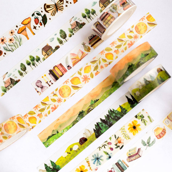 Set of decorative tape rolls with nature-themed designs on a white background