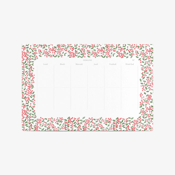 Notepad with floral border on a white background. Weekly schedule.