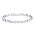 A silver tennis bracelet set with a continuous row of oval clear stones, shown on a clean white background. Waterproof, stainless steel and allergy free. By MIAJWL.

Bracelet tennis argenté serti d'une rangée continue de pierres transparentes ovales, présenté sur fond blanc épuré. Résistant à l'eau, en acier inoxydable et hypoallergénique. Par MIAJWL.
