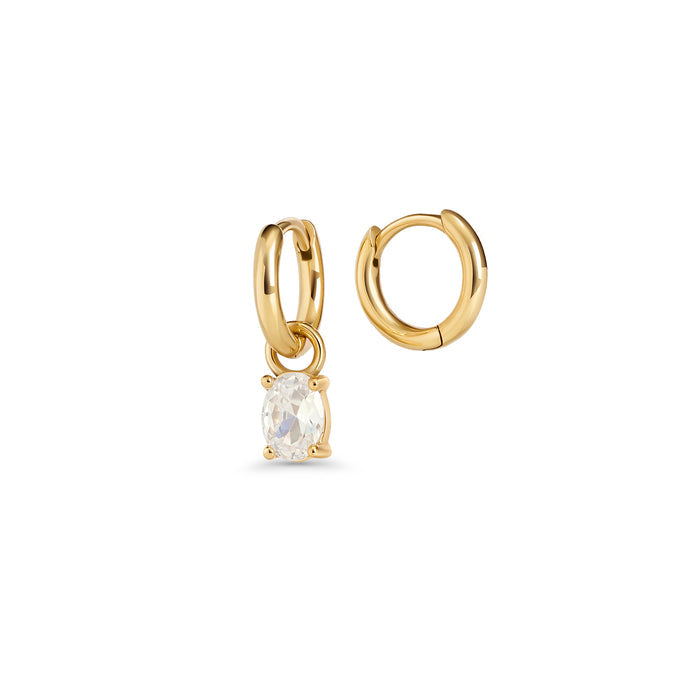 Gold hoop earrings with an oval clear stone pendant in a prong setting on a white background. 2-in-1. Jewelry by Mia Bijoux Canada.

Boucles d'oreilles anneaux dorées avec pendentif serti sur griffes d'une pierre transparente ovale sur fond blanc. 2-in-1. Bijoux par Mia Bijoux Canada.